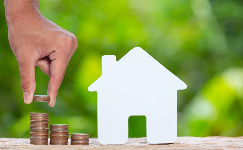 huis met munten naast